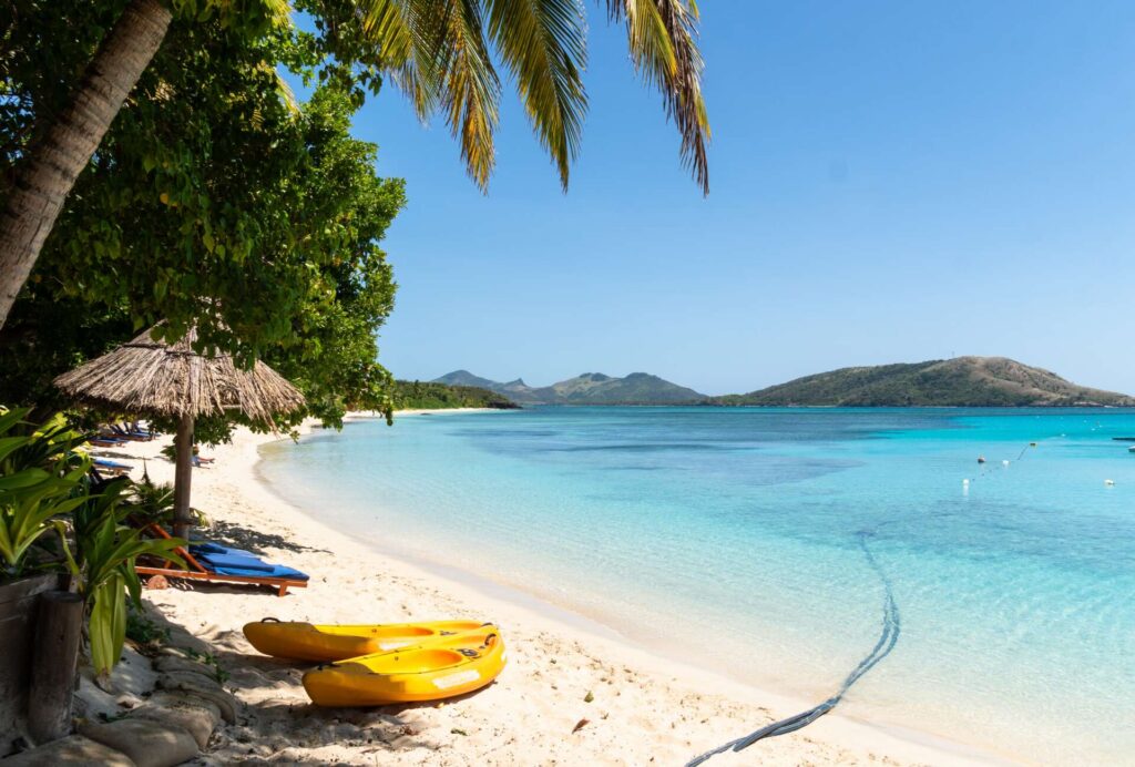 Yasawa,,Fiji:,Idyllic,Beach,With,Palm,Trees,And,Turquoise,Water